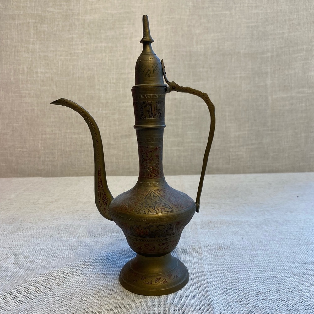 Brass pitcher engraving design, made in India.